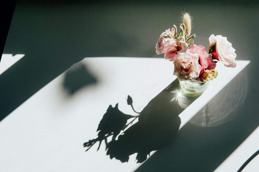 red and white flower bouquet on white table